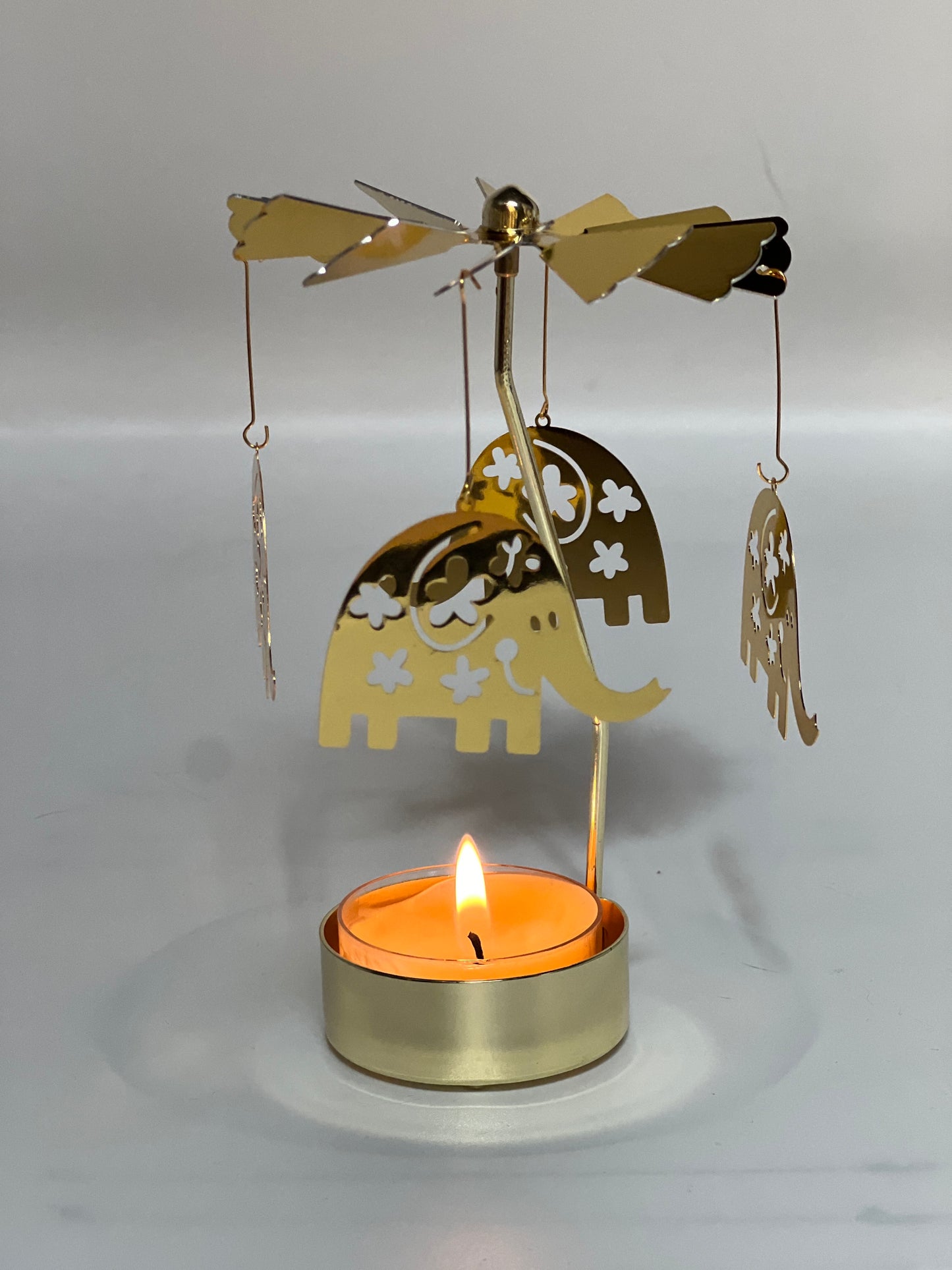 Spinning candle carousel - golden elephants with candle