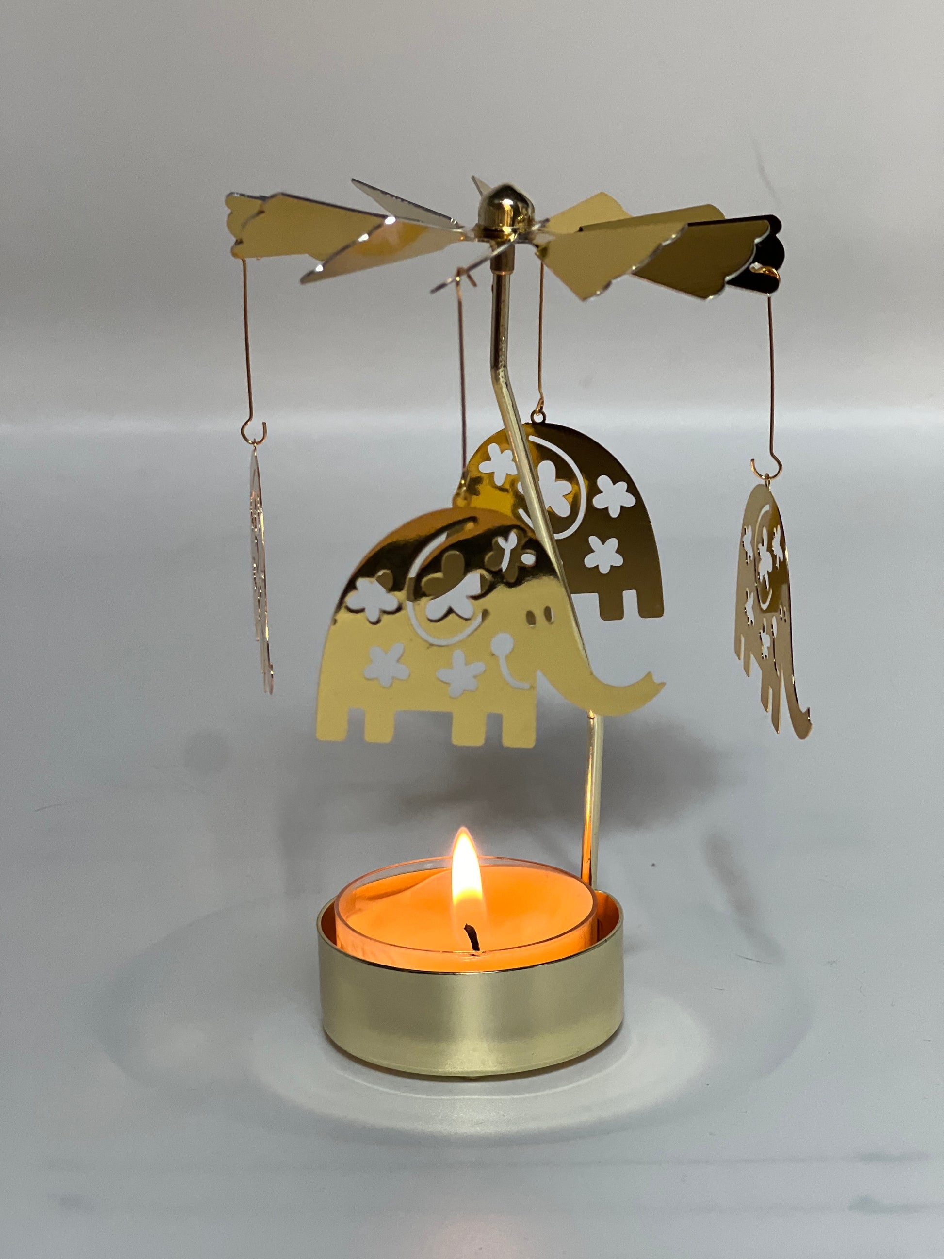 Spinning candle carousel - golden elephants with candle